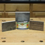 Liberon Special Effects Wax can with black finish samples on pine, oak, and poplar wood blocks