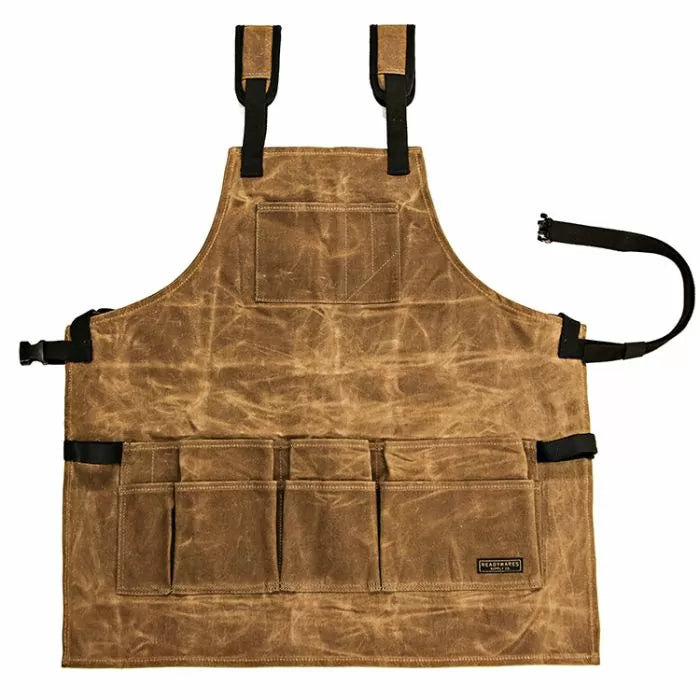 Brown waxed canvas woodworking apron with multiple front tool pockets and adjustable straps
