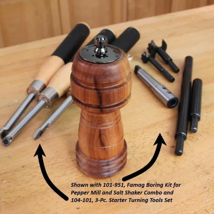 Wood pepper mill on workbench with woodturning tools and boring kit for pepper mill making.