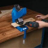 Pocket hole jig clamped to workbench with drill and wood board for woodworking joinery