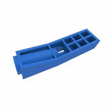 Blue plastic woodworking jig with pocket holes, isolated on white background