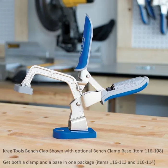 Bench clamp with blue grips mounted on a woodworking bench in a workshop setting