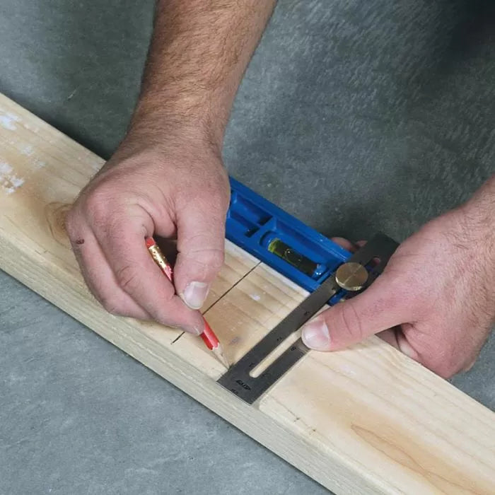 Marking wood with a square tool and pencil for precise woodworking measurement