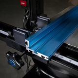 Blue aluminum table saw fence rail with ruler guide for woodworking precision