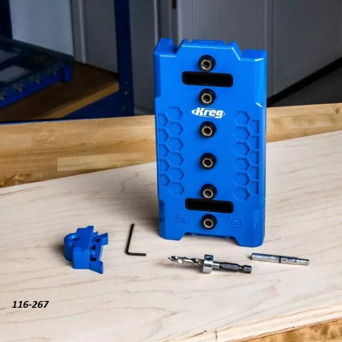 Blue woodworking pocket hole jig set with drill bit and hex key on a wooden surface