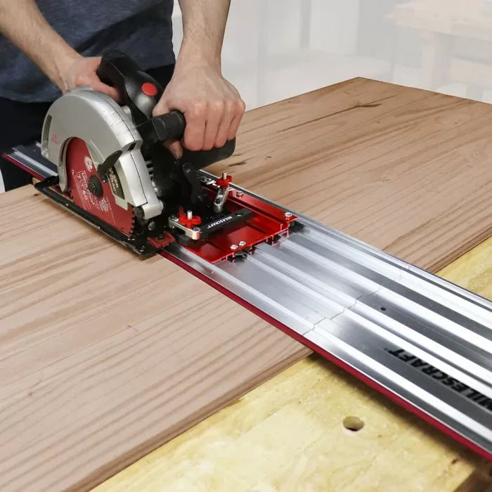 Circular saw with track guide cutting wood for precise straight woodworking cuts