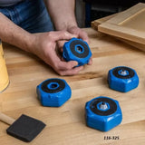 Blue woodworking bench cookies on a wooden workbench with hands holding one
