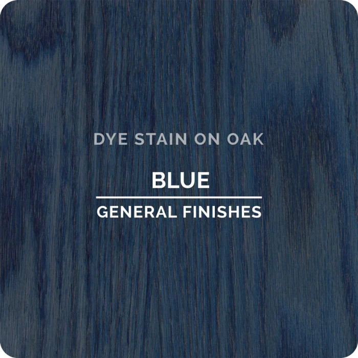 Blue dye stain on oak wood sample with visible grain texture, labeled General Finishes.