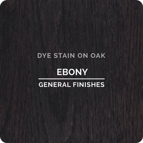Ebony dye stain on oak wood sample, dark finish, for woodworking projects.