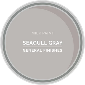 Seagull Gray milk paint sample from General Finishes shown in a paint tin top view.