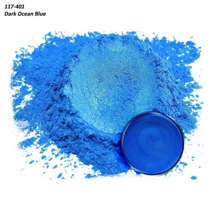 Dark ocean blue pigment powder with matching mixed resin sample in a container