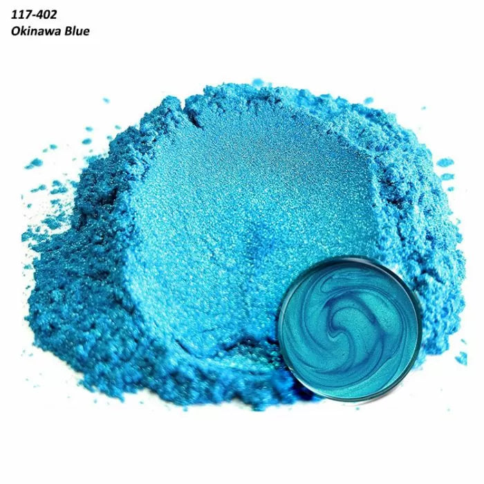 Vibrant Okinawa Blue mica pigment powder with a round sample of mixed blue resin.