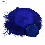 Vibrant Noken Blue pigment powder for woodworking, shown loose and in a small container.