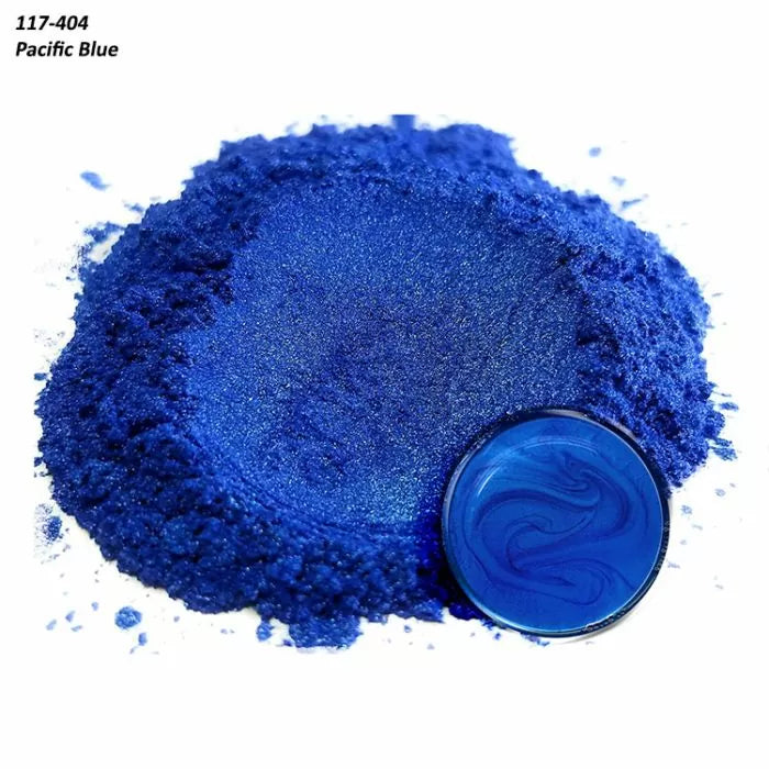 Pacific Blue mica pigment powder pile with resin sample, bright blue color for woodworking projects