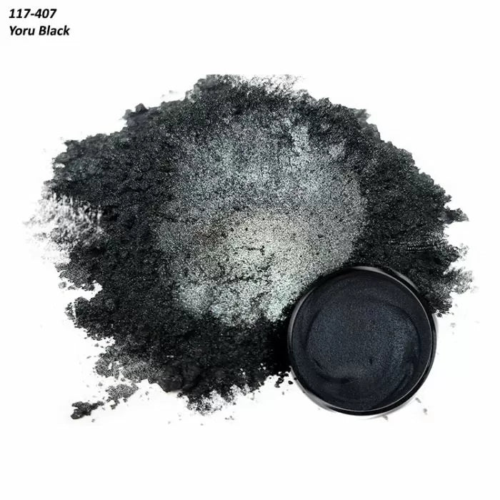 Yoru Black metallic mica powder pigment in a small container and loose pile, for woodworking projects