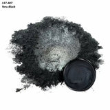 Yoru Black metallic mica powder pigment in a small container and loose pile, for woodworking projects