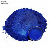 Skyline Blue metallic pigment powder with a matching blue liquid sample in a container