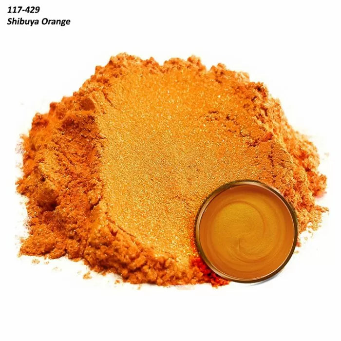 Orange mica powder pigment with a small dish showing mixed Shibuya Orange color