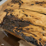 Finished live edge wood slab with filled cracks and enhanced grain for woodworking projects