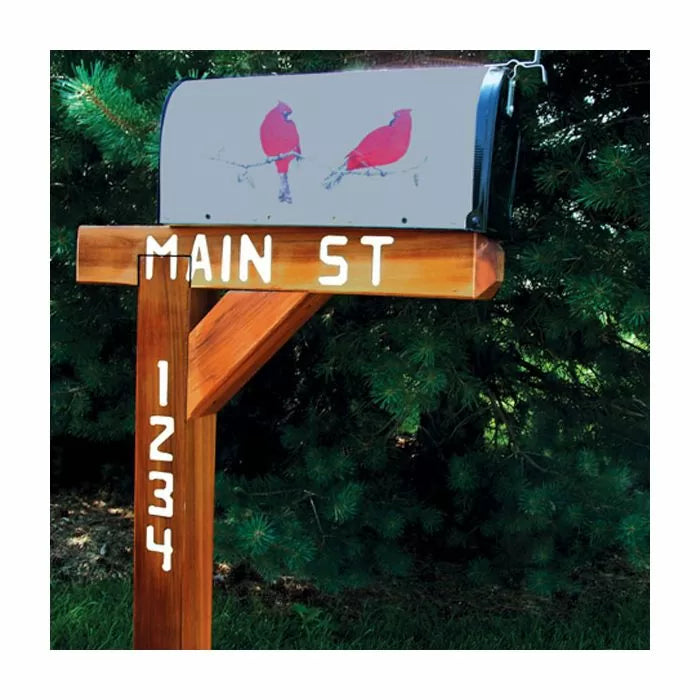 Wooden mailbox post with Main St and 1234 painted, mailbox featuring two red cardinals