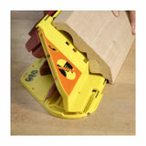 Woodworking push block gripping large molding on workbench for safe cutting