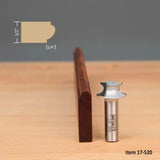 roundover router bit with profile sample and cut wood edge on a wooden surface