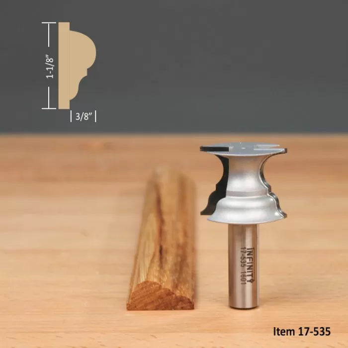 Crown molding router bit with sample wood trim, profile dimensions 1-1/8 x 3/8 inches