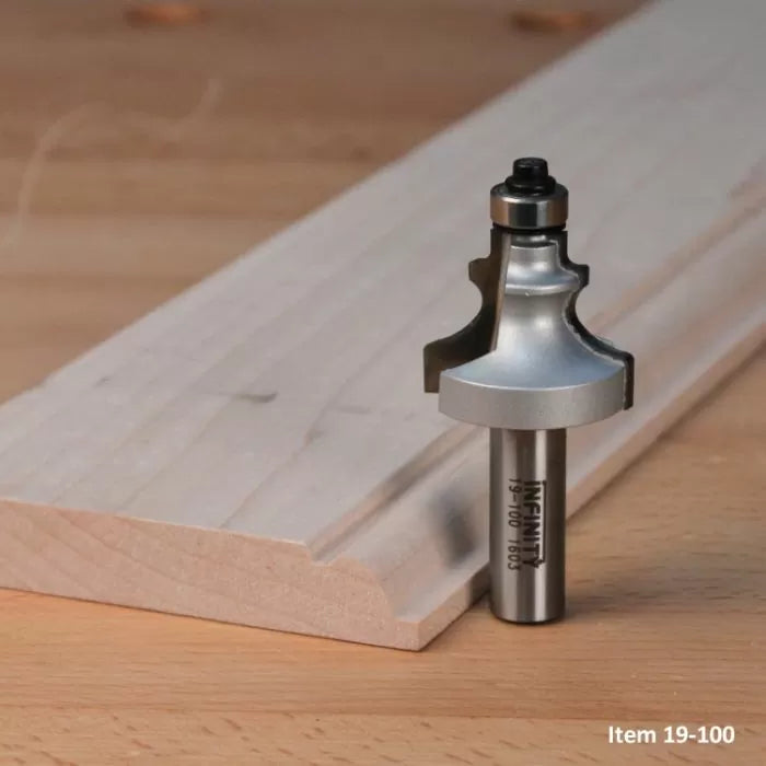 Roman ogee router bit for woodworking, with detailed edge cut sample on a wooden board