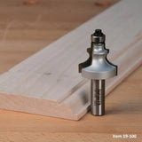 Roman ogee router bit for woodworking, with detailed edge cut sample on a wooden board