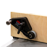 Close-up of Jessem stock guide with roller, mounted on a woodworking fence