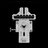 Adjustable woodworking drill guide jig with measurement markings and multiple bushings