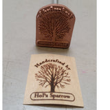 Custom metal wood branding iron with tree design and stamped wood label