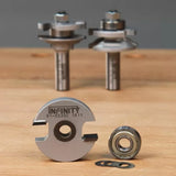 Woodworking router bits and slot cutter set on wooden surface, close-up view