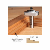 Woodworking router bit with ball bearing and picture frame moulding profile on wooden surface