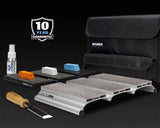 Woodworking chisel sharpening kit with honing guide, abrasive blocks, lapping fluid, and storage case