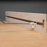 Wooden router table fence with T-track and metal adjustment bar for woodworking precision