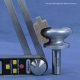 Woodworking router bit with sample profile cut, digital angle gauge, and caliper tool