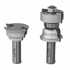 Set of two steel woodworking router bits with decorative profiles on white background