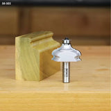 Classical router bit with ball bearing and wooden profile sample on workbench