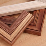 Assorted wooden picture frame corners showcasing detailed molding and woodworking joints.