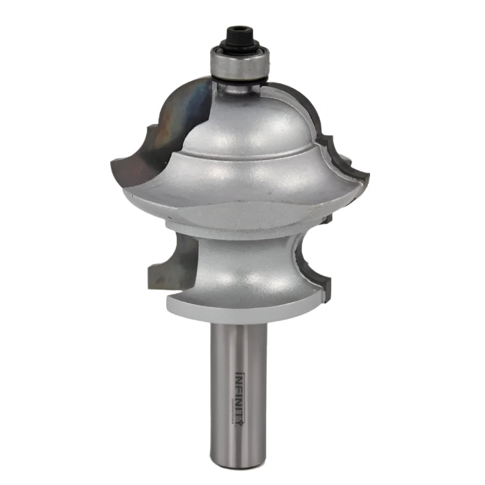 Large silver ogee raised panel router bit for woodworking, isolated on white background.
