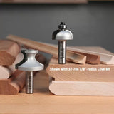 Cove router bits on display with shaped wooden trim samples, woodworking tool closeup