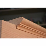 Close-up of decorative wood moulding profile on cabinet door, woodworking detail