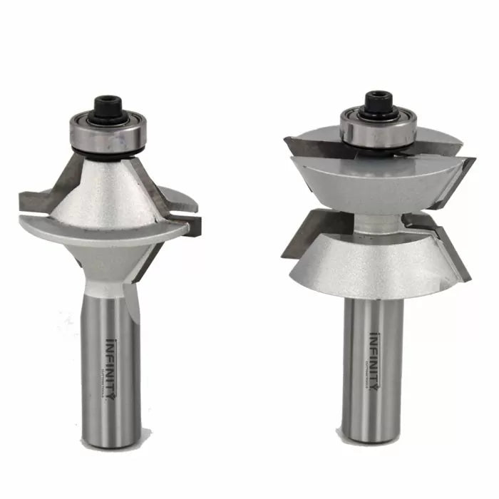 Two carbide-tipped router bits for woodworking joinery on a white background.