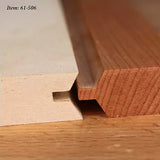 Close-up of two wooden boards with tongue and groove joinery on a workbench