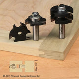 Plywood tongue and groove router bit set with carbide blades for woodworking joinery.