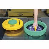 Person cleaning circular saw blade with twist-action blade cleaning tool in workshop