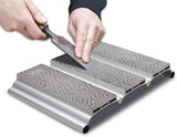 Sharpening a woodworking chisel on a diamond sharpening stone sharpening system