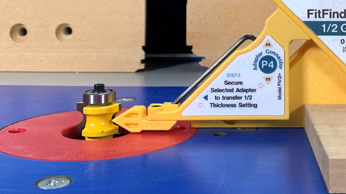 Router table setup with yellow router bit gauge and thickness setting tool for woodworking