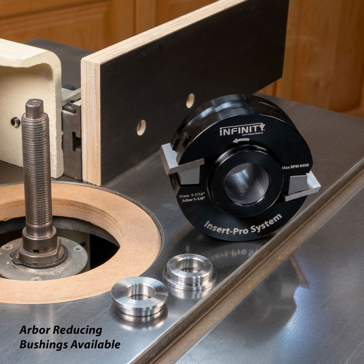 Insert-Pro shaper cutter head and bushings on a woodworking shaper table